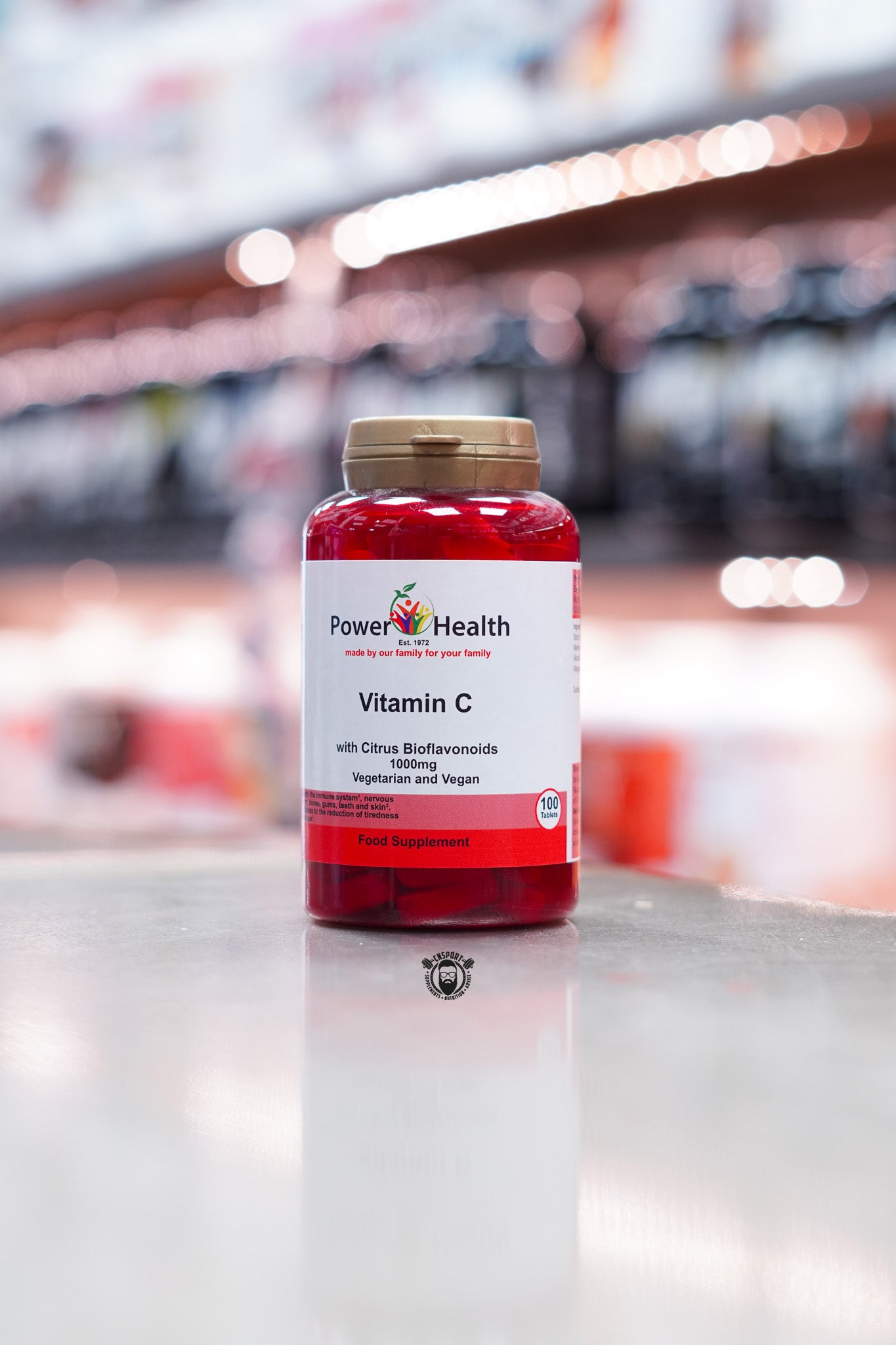 Front view of Power Health Vitamin C with Citrus Bioflavonoids, 1000mg strength, labelled as vegetarian and vegan, 100 tablets in a red bottle with white and red label.
