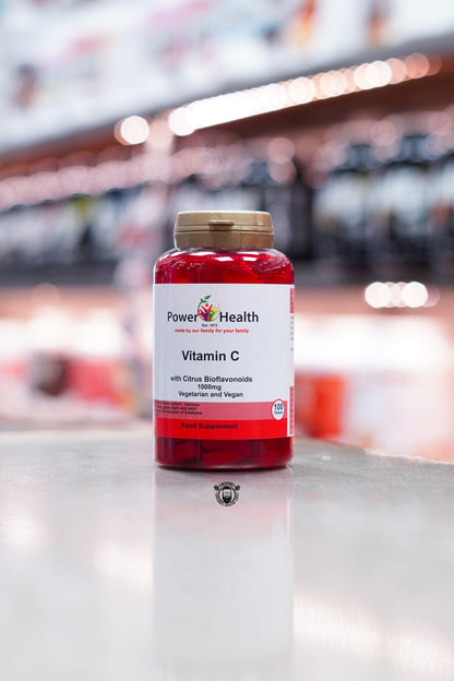 Front view of Power Health Vitamin C with Citrus Bioflavonoids, 1000mg strength, labelled as vegetarian and vegan, 100 tablets in a red bottle with white and red label.