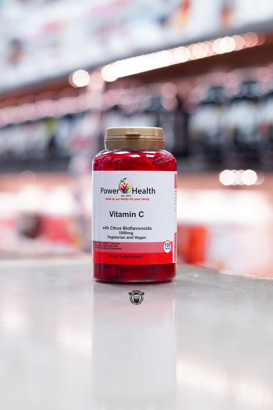 Front view of Power Health Vitamin C with Citrus Bioflavonoids, 1000mg strength, labelled as vegetarian and vegan, 100 tablets in a red bottle with white and red label.