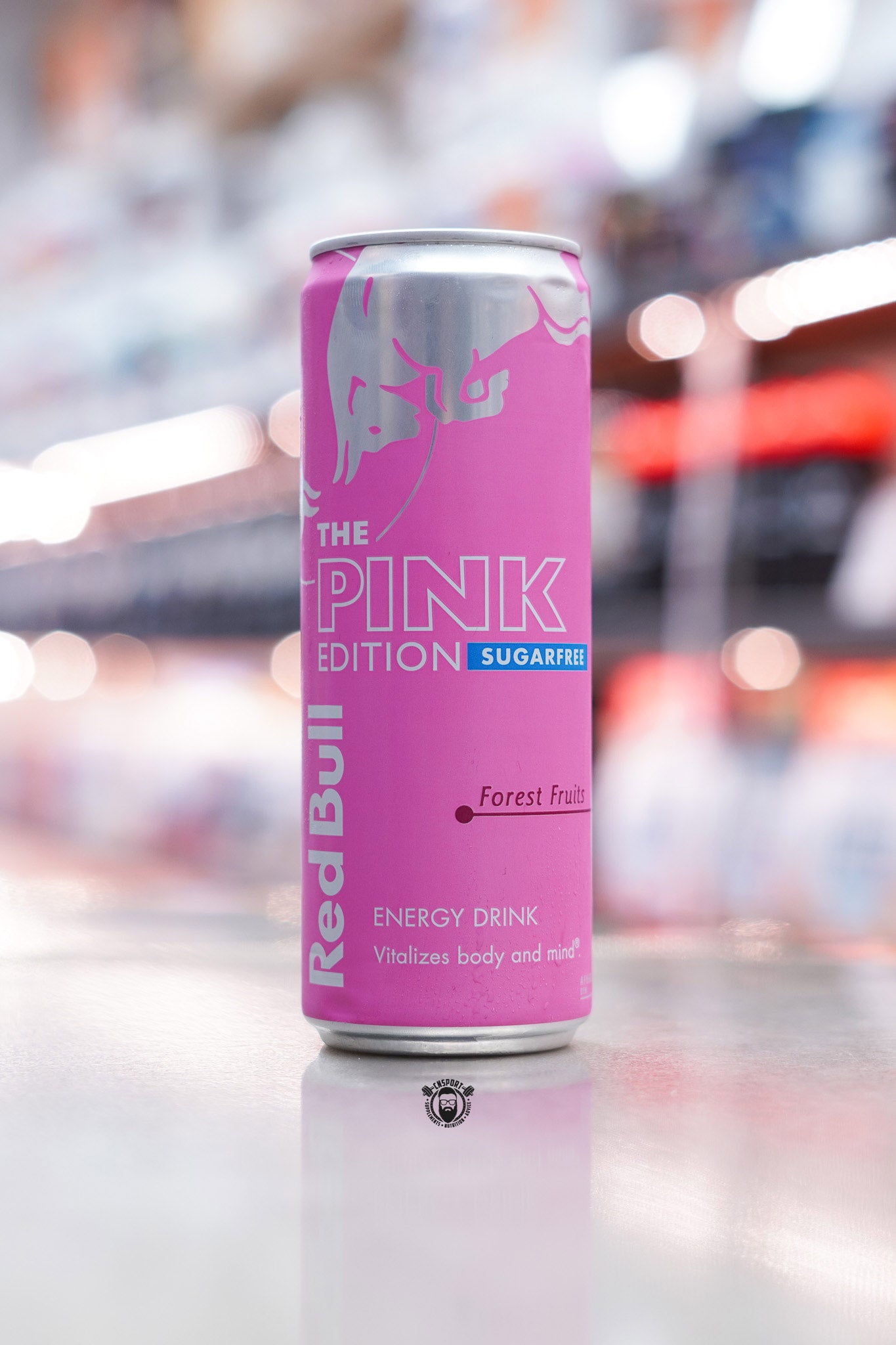 Front-facing photo of Red Bull The Pink Edition Sugarfree 355ml can featuring “Forest Fruits” flavour in bright pink design with silver bull logo.