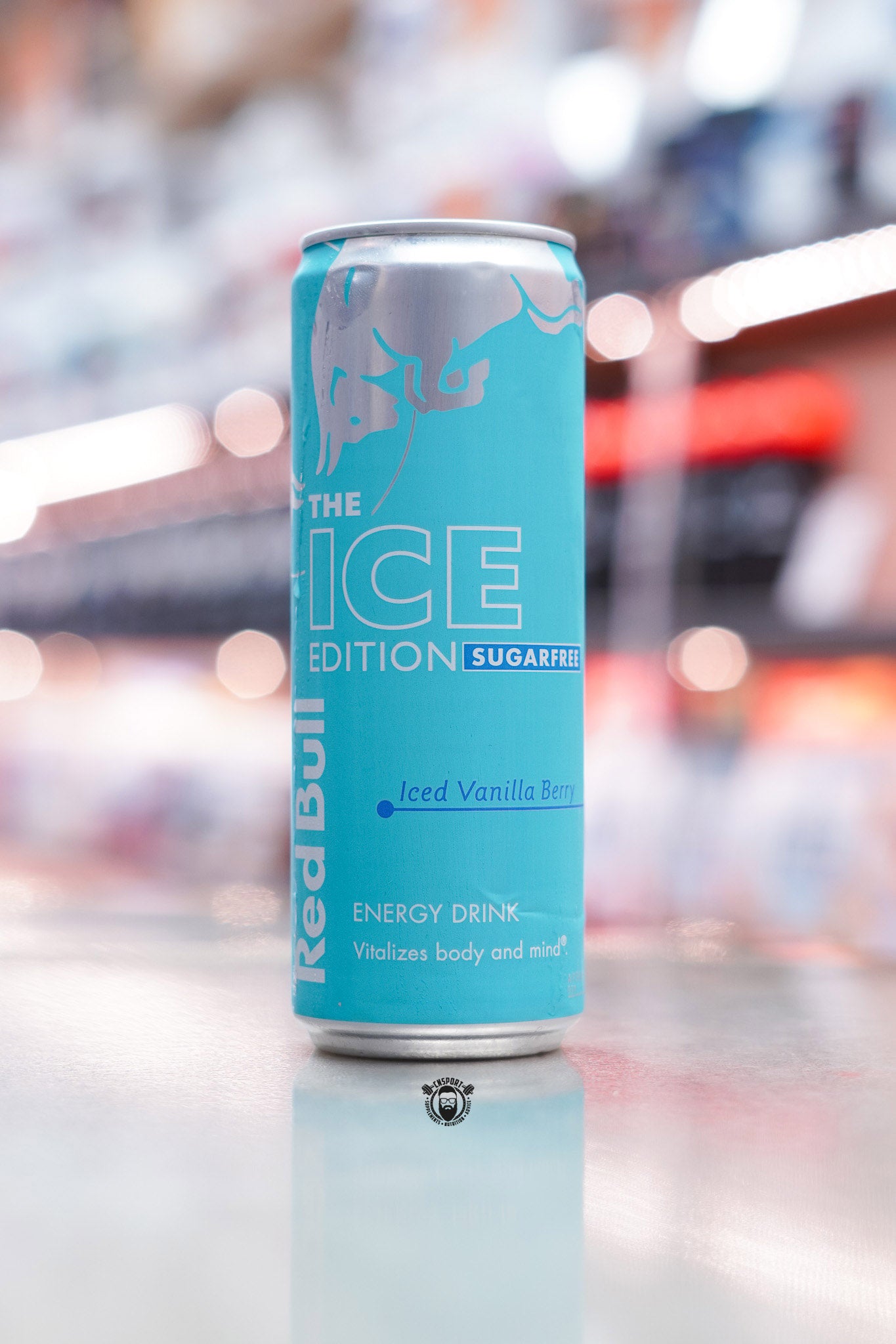 Front view of Red Bull The Ice Edition Sugarfree 355ml can in turquoise blue with silver branding and “Iced Vanilla Berry” label.