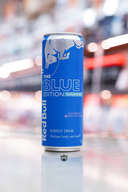 Front-facing image of Red Bull The Blue Edition Sugarfree 355ml can with deep blue metallic design and “Juneberry” flavour text.