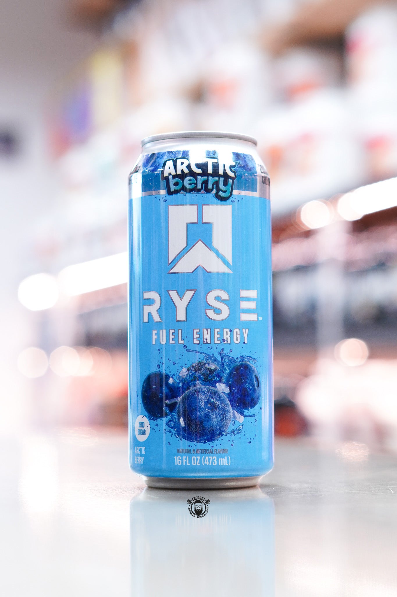 Ryse Fuel Energy Arctic Berry can on a reflective surface with a blurred background