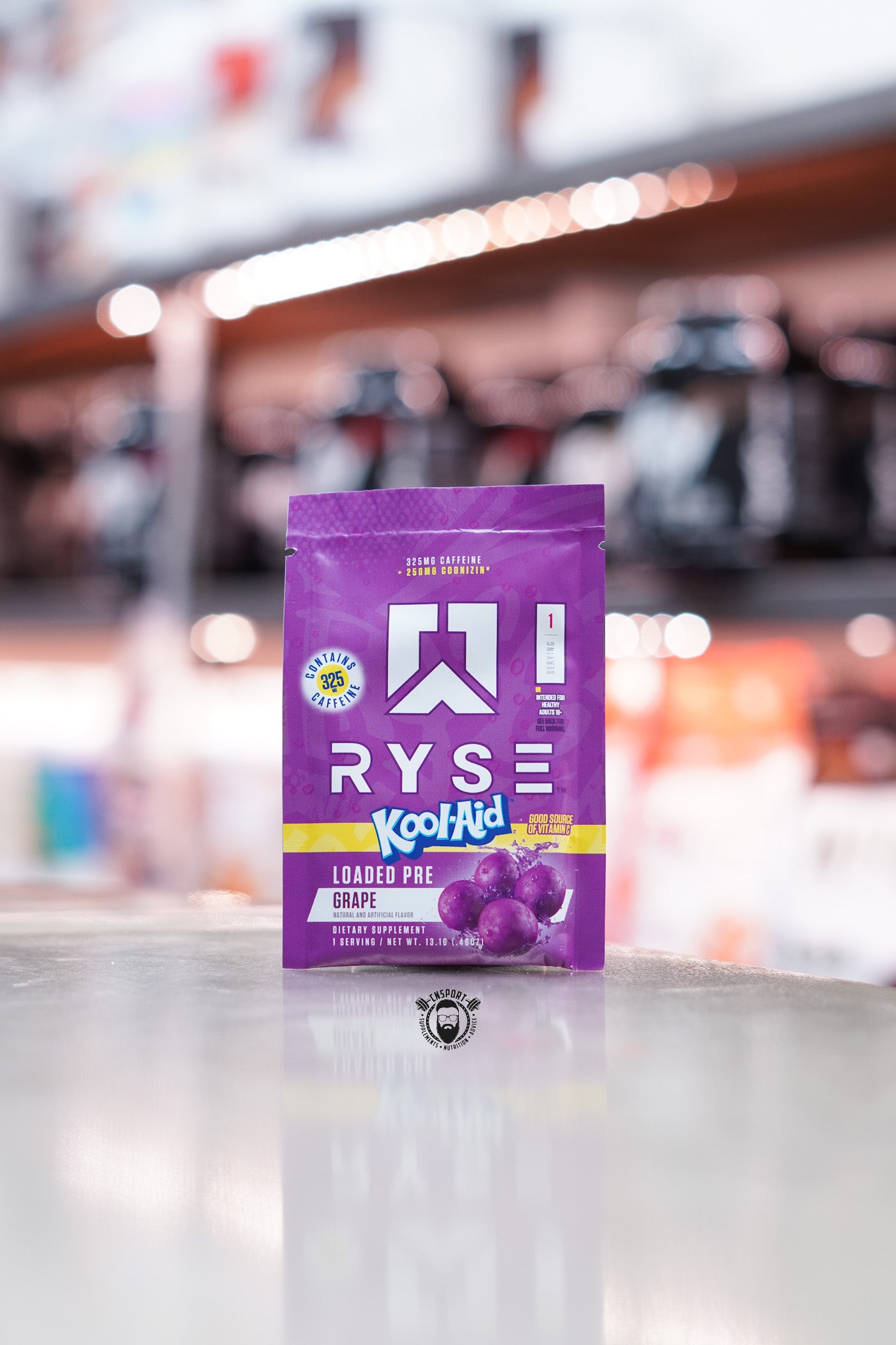 Purple sachet of Ryse Loaded Pre in collaboration with Kool-Aid, grape flavour, featuring grape imagery and caffeine content highlighted.