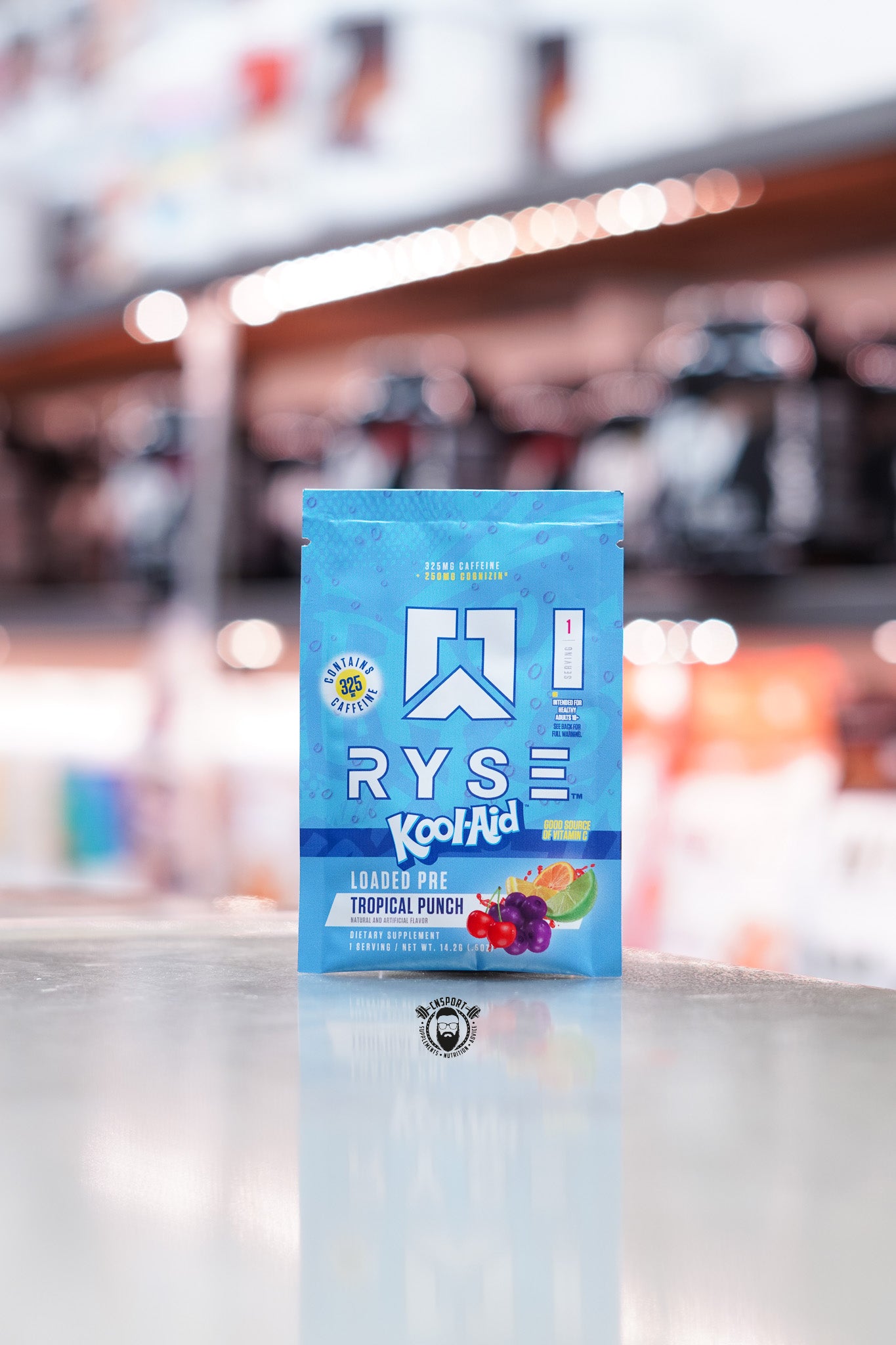 Blue sachet of Ryse Loaded Pre in collaboration with Kool-Aid, tropical punch flavour, with fruit imagery including orange, grape, and lime.