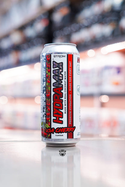 Strom HydraMax USA Cherry hydration drink can made with real coconut water on retail counter with blurred supplement store background
