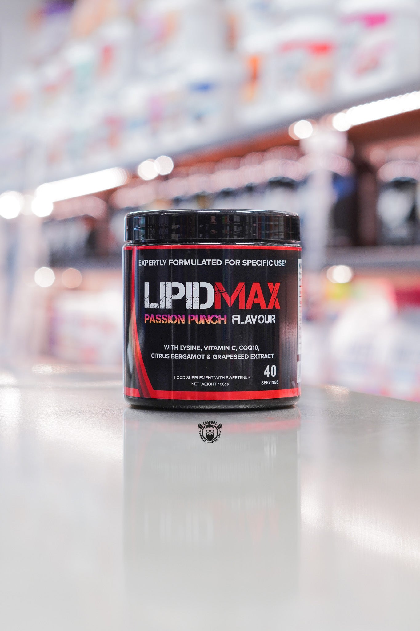 Strom Sports LipidMax Passion Punch flavour supplement tub front view on a reflective surface