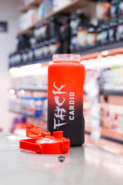 TWP Cardio 2L hydration water bottle in a red and black frosted finish with flip-top lid removed, displayed on a supplement store counter.