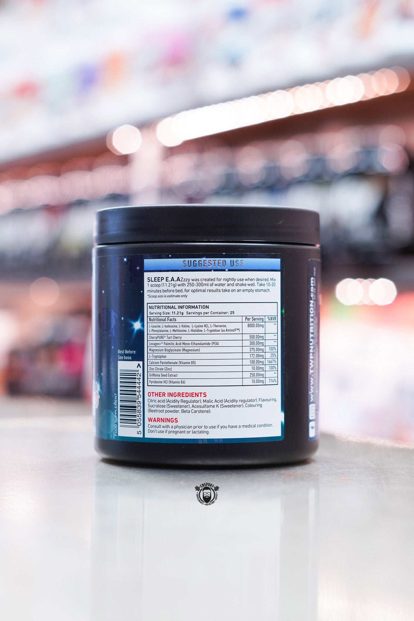 Close-up of TWP Sleep EAAzzzy Peaches & Dreams label showing full supplement facts, ingredients list, and suggested use instructions.