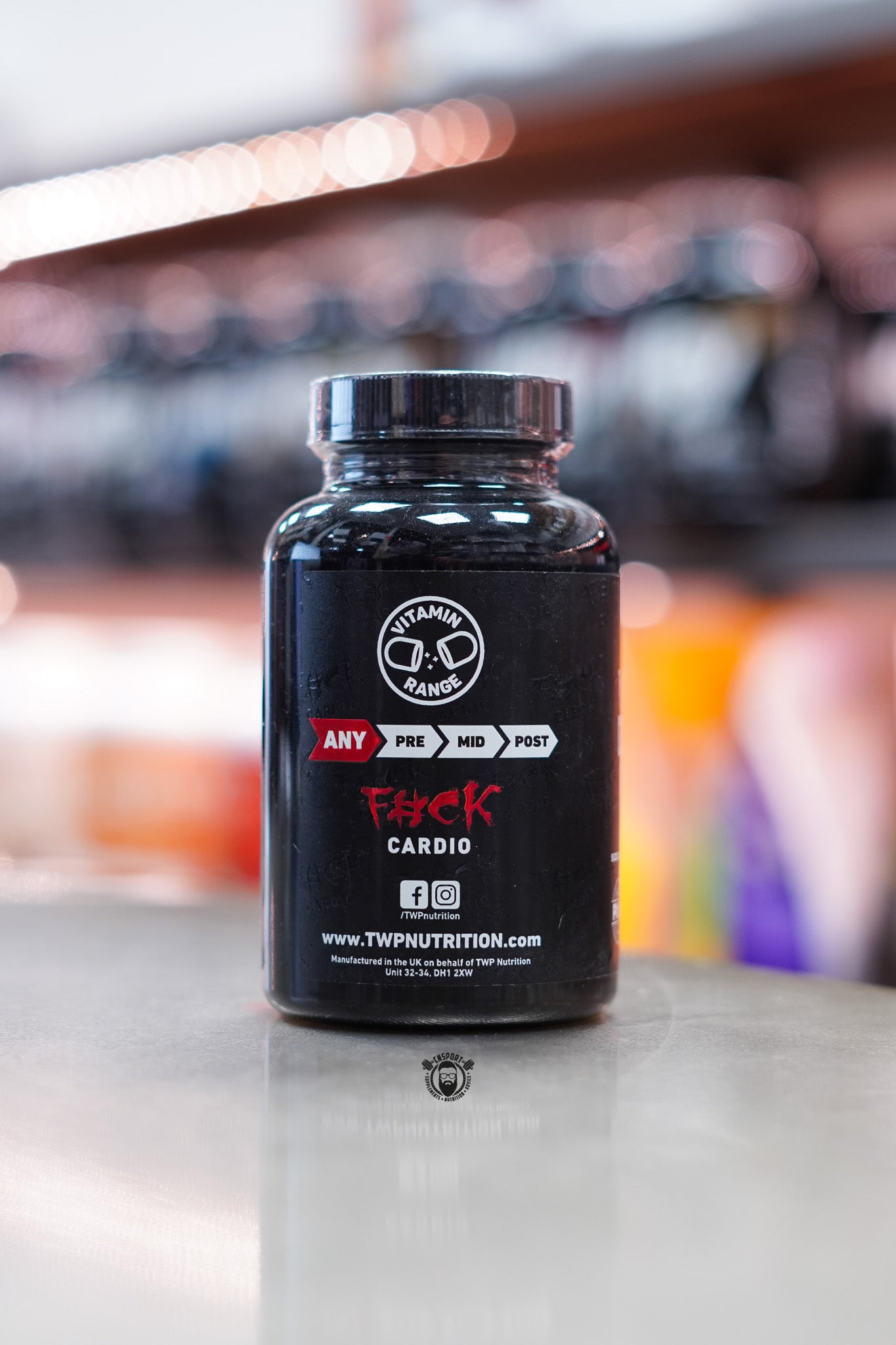 Side view of TWP Vit D3 + K2 RAW bottle displaying brand slogan, usage timing chart, and social media information.