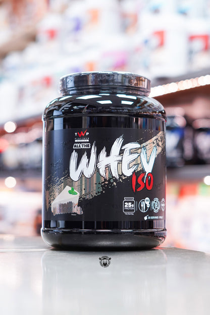 Front-facing image of TWP All The Whey Iso Vanilla Cheesecake flavour featuring a dark design with cheesecake illustration and protein details.