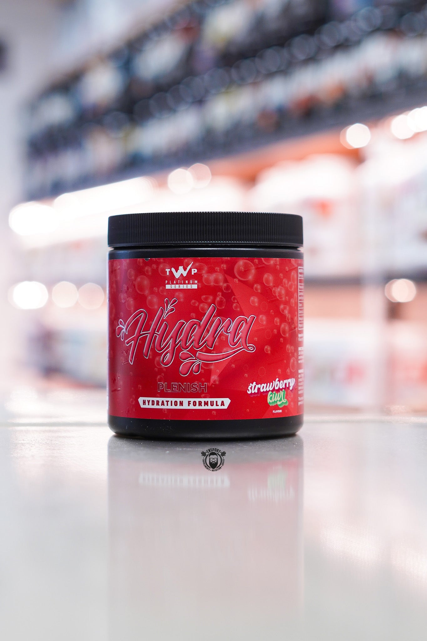 TWP Hydra Plenish hydration formula, Strawberry Kiwi flavour, 30 servings tub with red label.